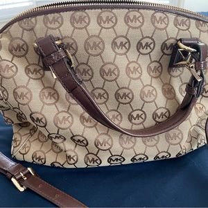 Micheal Kors purse. Brown with leather trimmings.